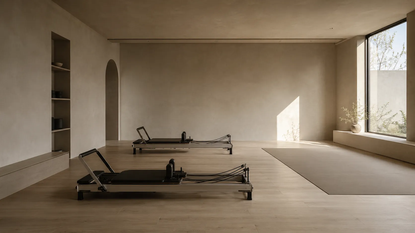 The studio space: a quiet, light-filled room with two reformers.
